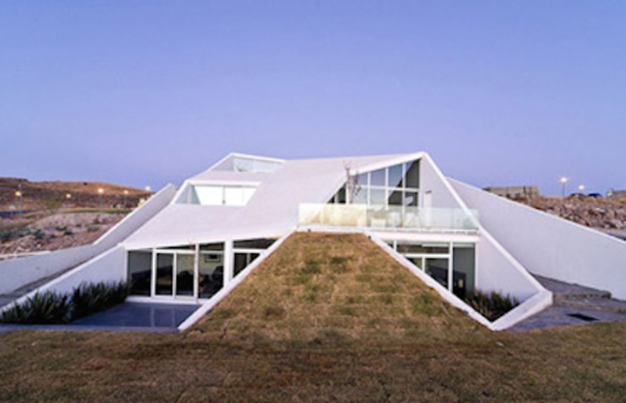 Mexican House Built into a Mountainside in a Golf Field