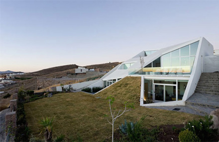 Mexican House Built into a Mountainside in a Golf Field