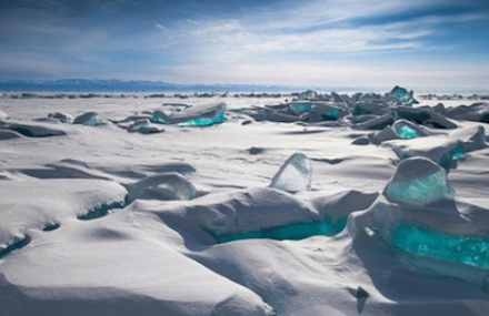 Turquoise Ice Gems Emerging From Russian Lake