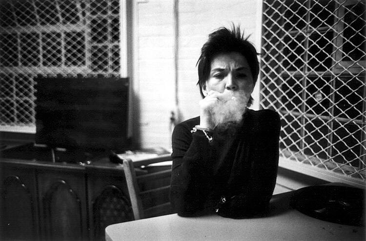 Mona at a Table Blowing Smoke, 1976