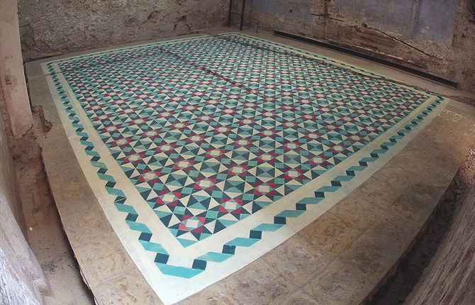 Geometric Tile-Like Patterns Sprayed on Floors in Abandoned Buildings