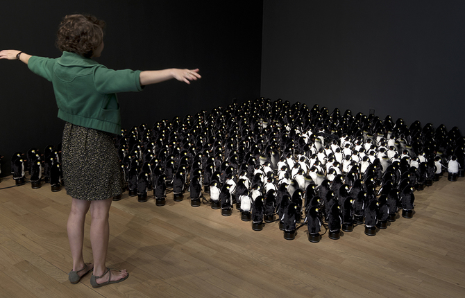 Interactive Mirror Built from 450 Rotating Penguins