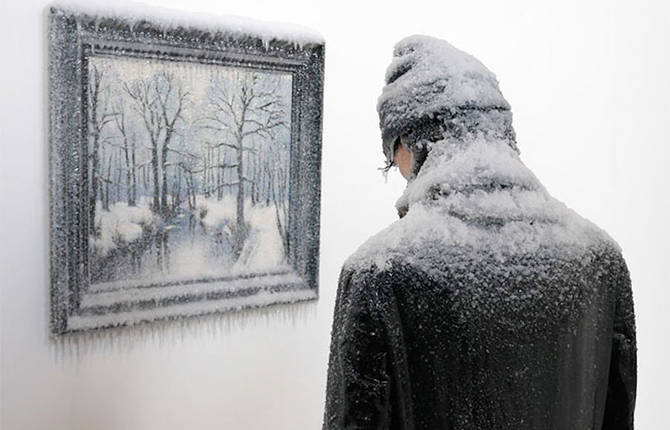 Frozen Man alongside Icy Painting