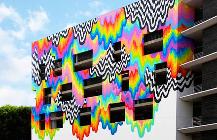 Vibrant Melting Paint Mural on a Mall Facade