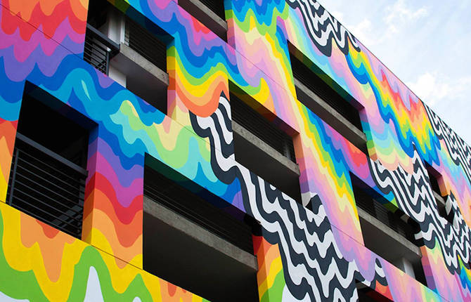 Vibrant Melting Paint Mural on a Mall Facade