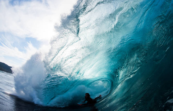 Surfers Inside Barrel Waves