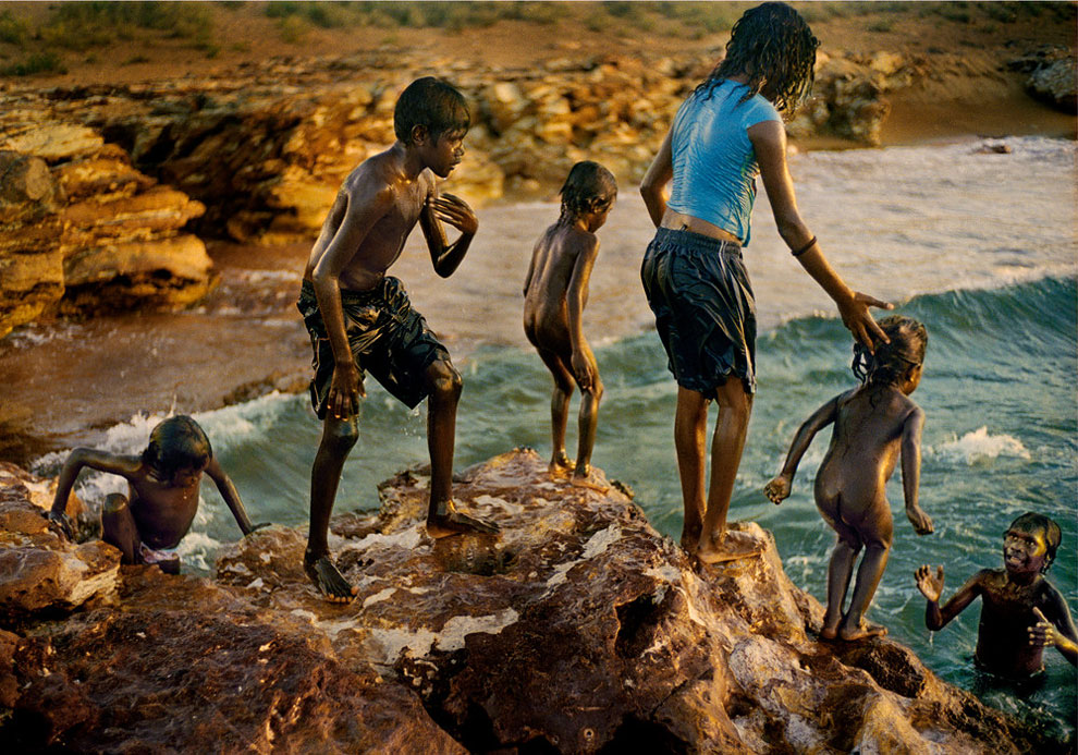 Children Cooling Off at Dhiari Homeland. Local children get wet and cool in Arnhem Land. (Photo by Matthew Abbott:Australian Life Prize 2015)