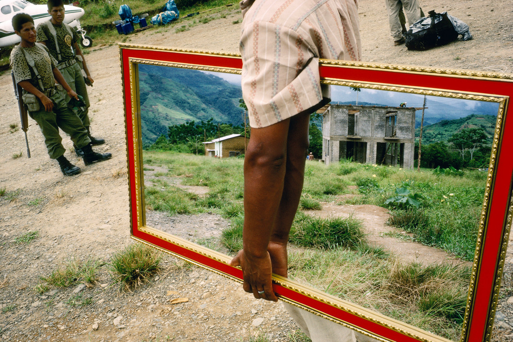 PERU. Palmapampa. 1993. Mirror vendor on a landing strip.