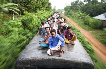 Dangerous Travel on Train Tops of Workers in Bangladesh