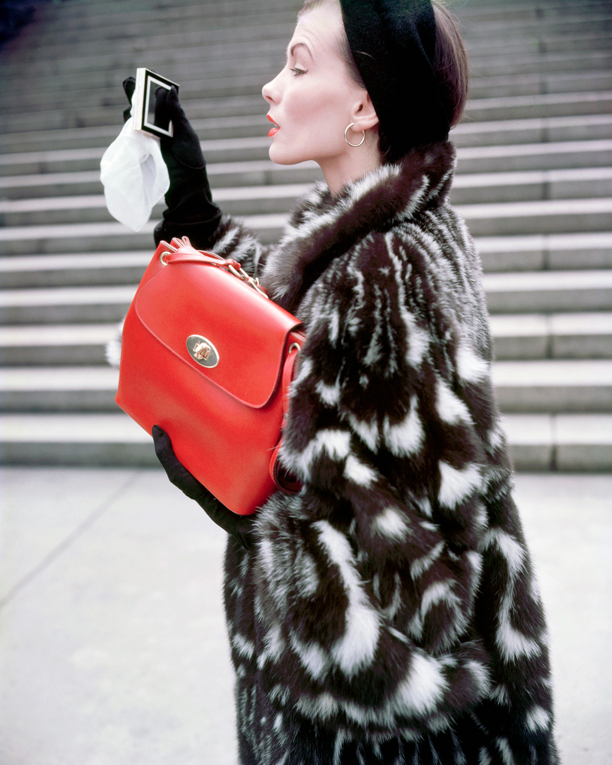 Modeling a Fur Jacket and Red Purse