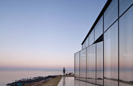 Cafe with Mirrored Facade & Pivoting Door in a Volcanic Island