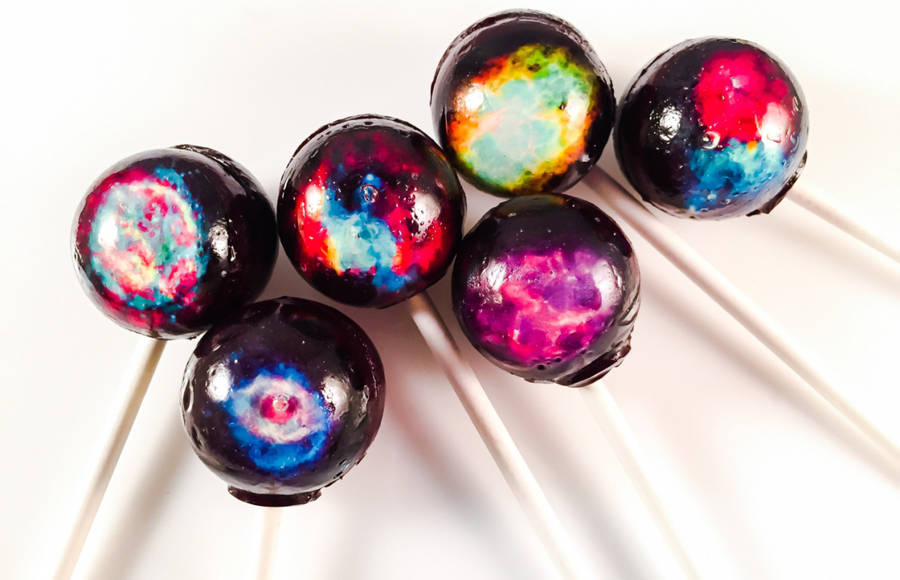 Transparent Lollipops Containing Galaxies and Famous Paintings