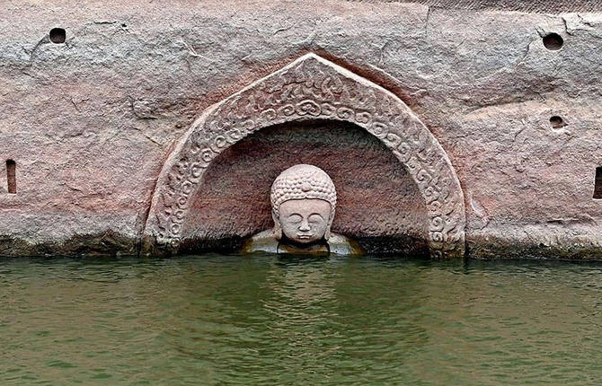 600-Year-Old Buddha Head Emerges From a Lake In China