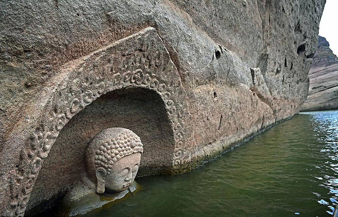 600-Year-Old Buddha Head Emerges From a Lake In China