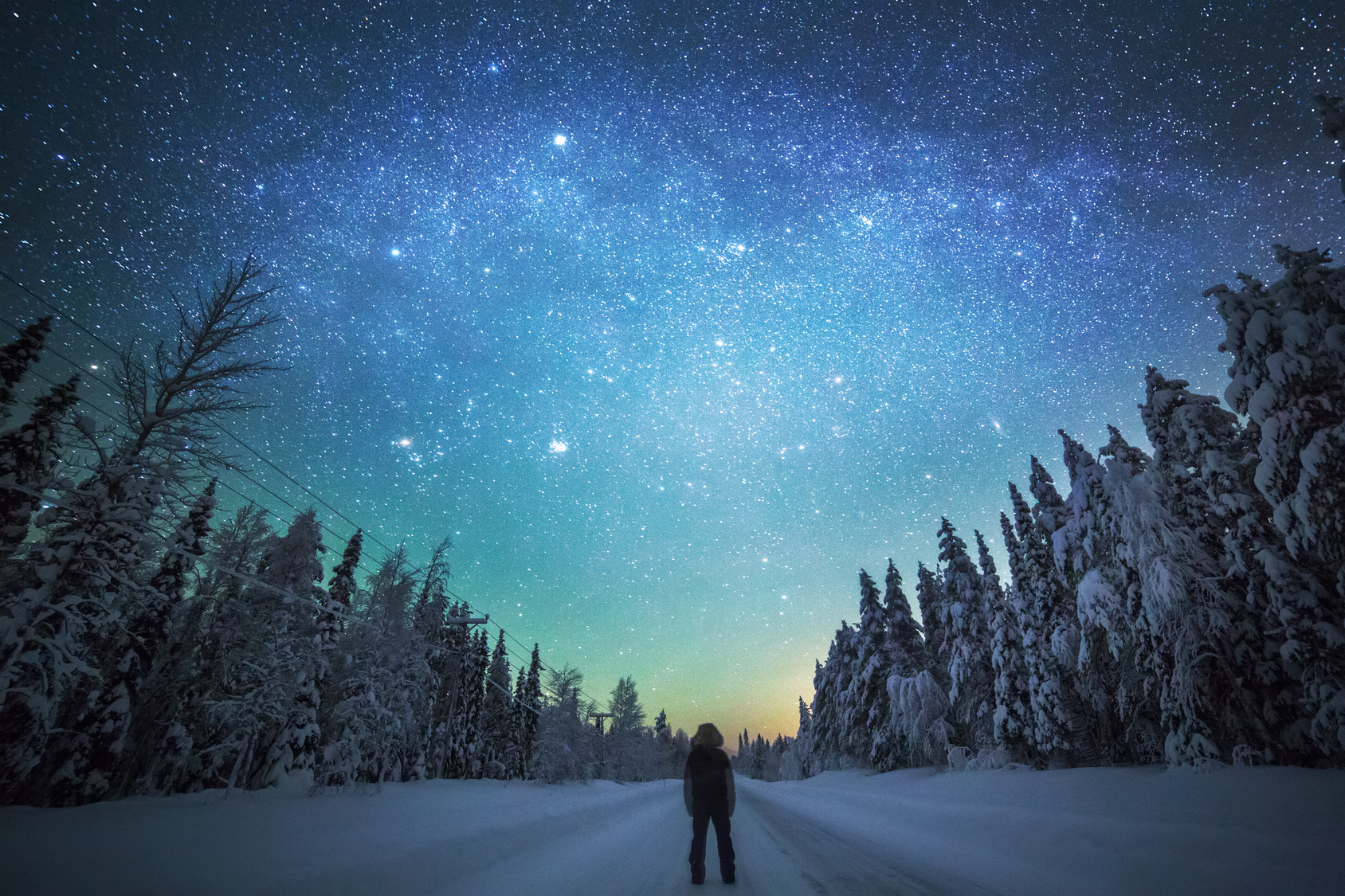 Person looking at starry winter sky, Finland