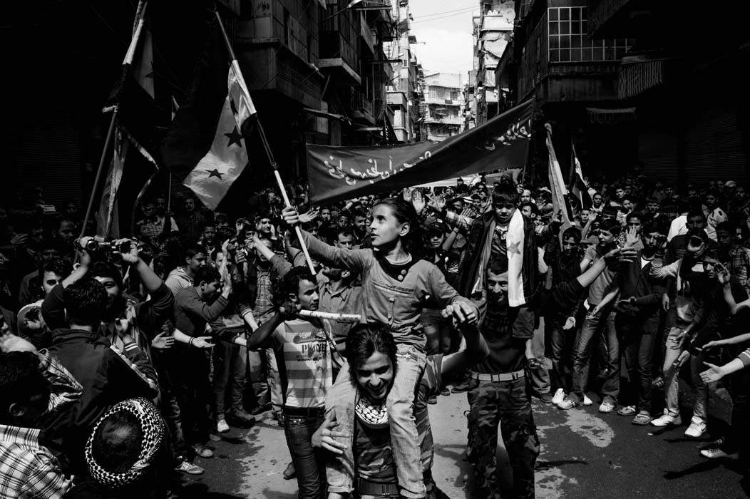 Bustan al-Qasr frontline neighborhood, April 5, 2013. The Friday demonstration is led by children. It usually comes under shellingThere are no foreign journalists around, today, in Aleppo. The battle peaked at the end of December, the Syrian conflict se