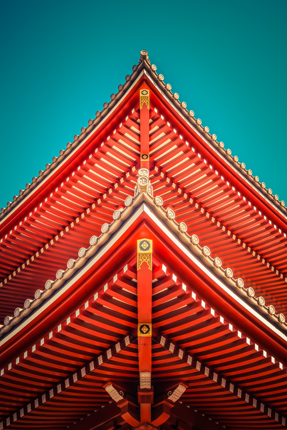 A symmetrical roof of a pagoda style house.