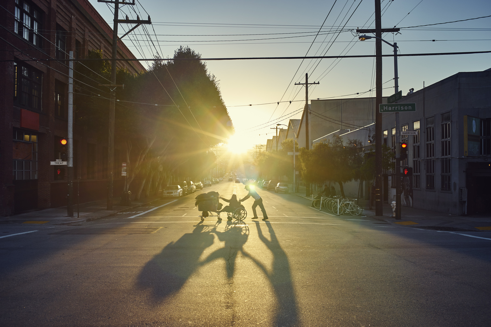 People crossing road at sunset, San Francisco, California, USA