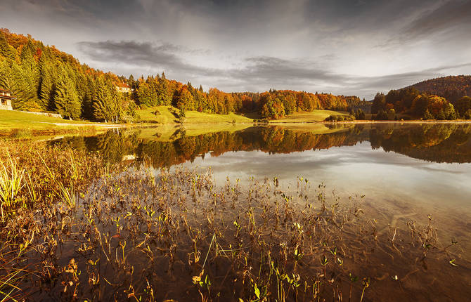 Stunning Autumnal Sunset On Lake Genin