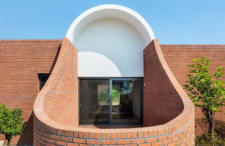 Curving Brick Walls Surround A South Korean Home