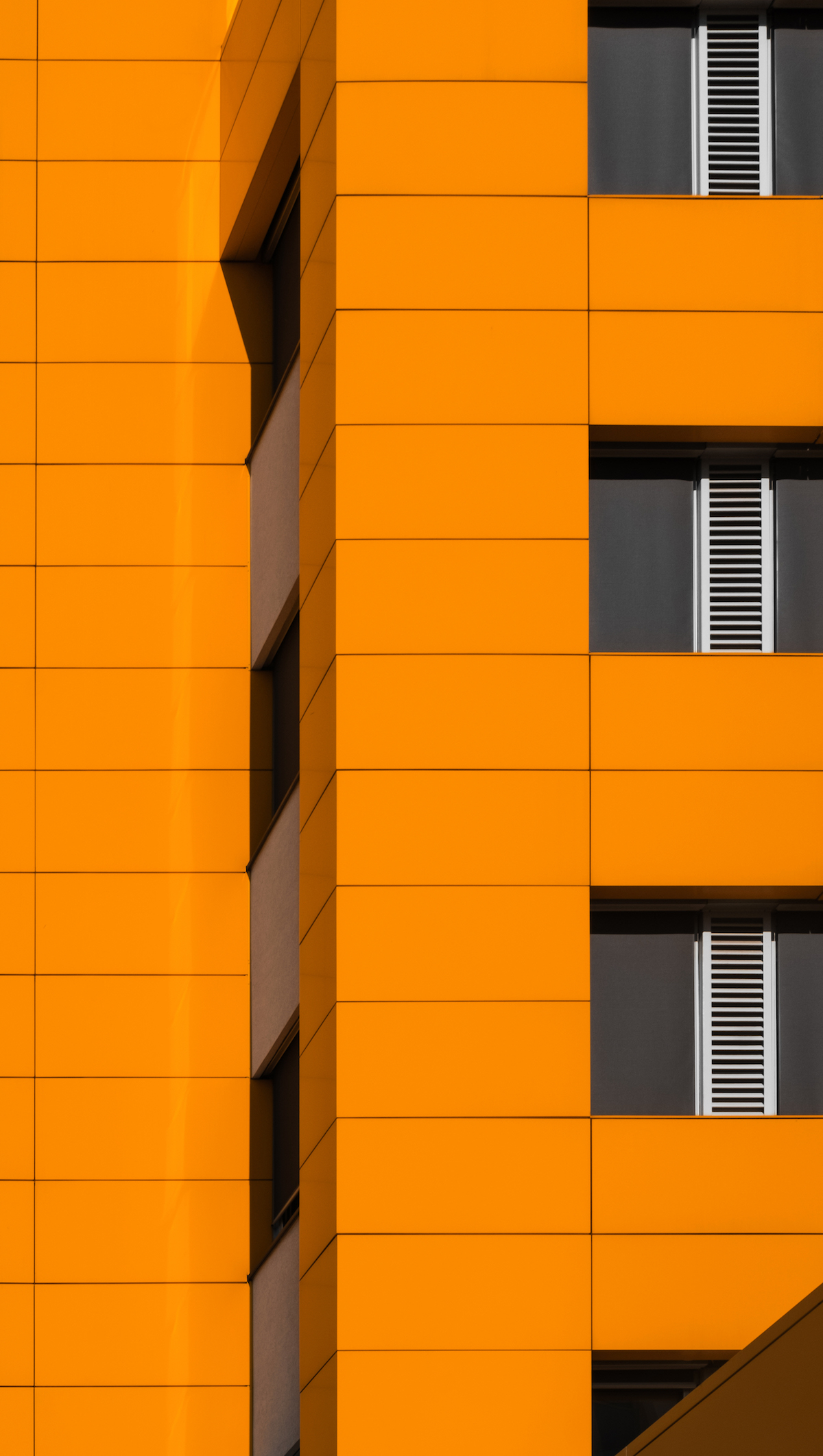 Detail of  facade on orange building.