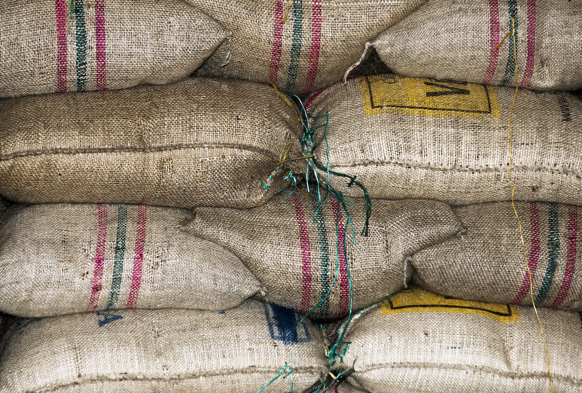 Stack of bags of coffee beans.