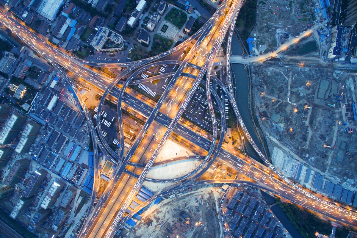 aerial view of traffic on road junction at night in hangzhou