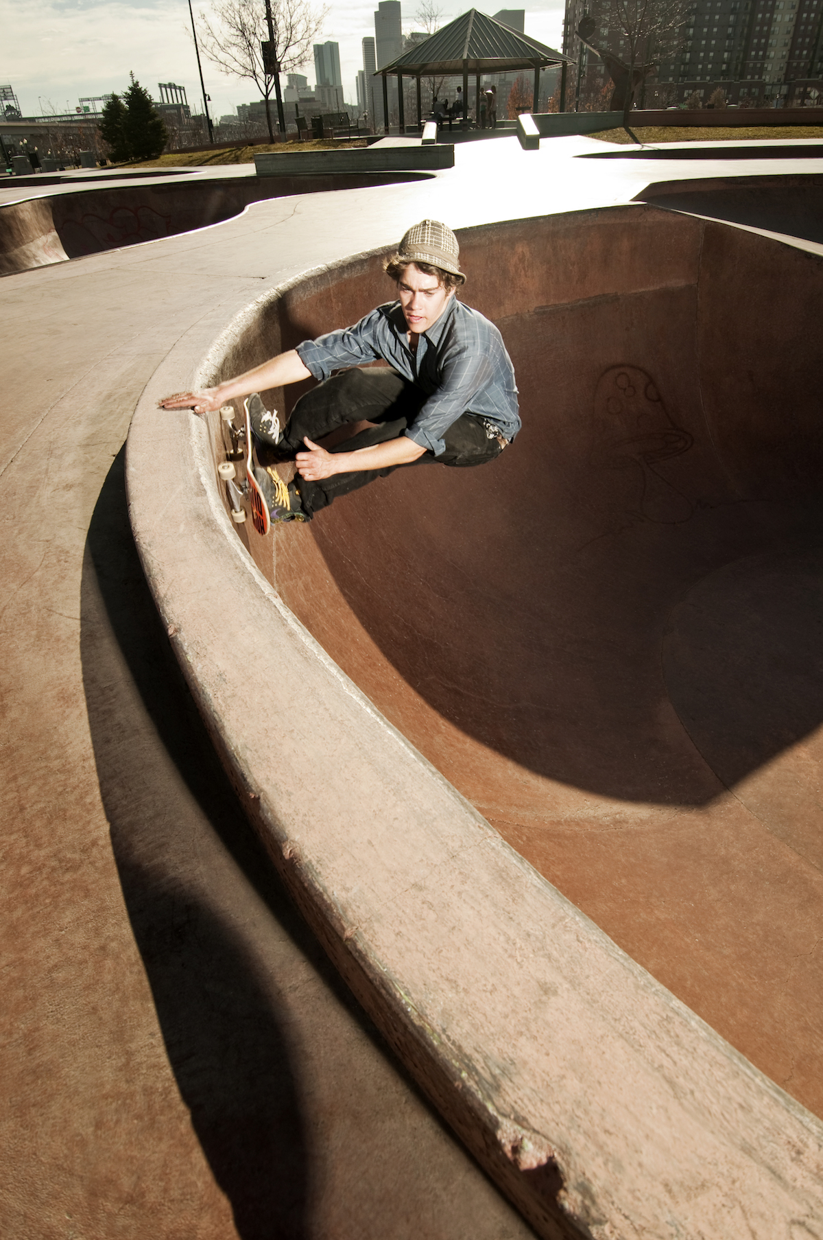 Guy Skateboarding in Pool