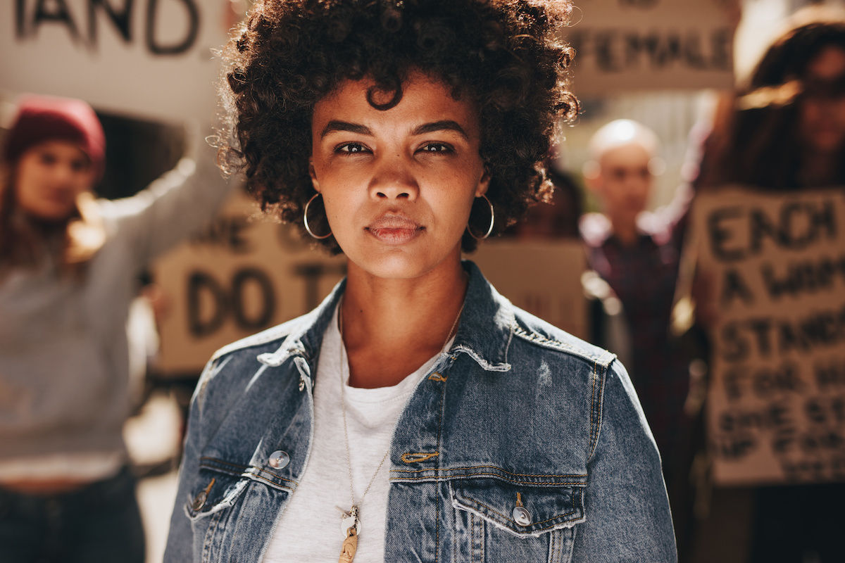 Woman activist protesting outdoors with group