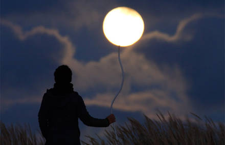 A Photographer Plays with the Moon