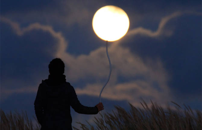 A Photographer Plays with the Moon